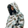 A woman is playing in a shark camouflage bape hoodie
