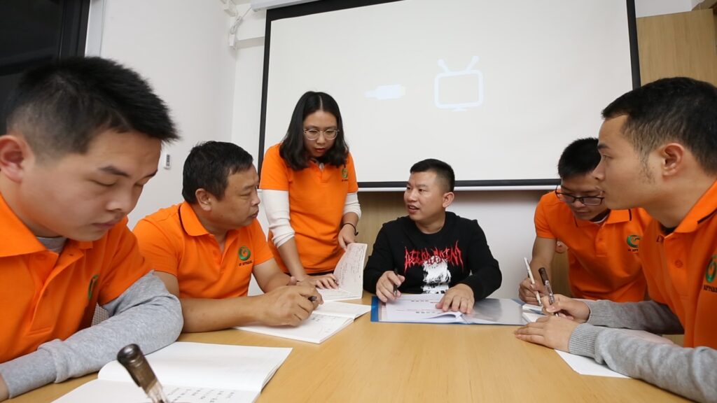 The modaknits team is discussing modernizing hoodie manufacturing as an inevitable trend