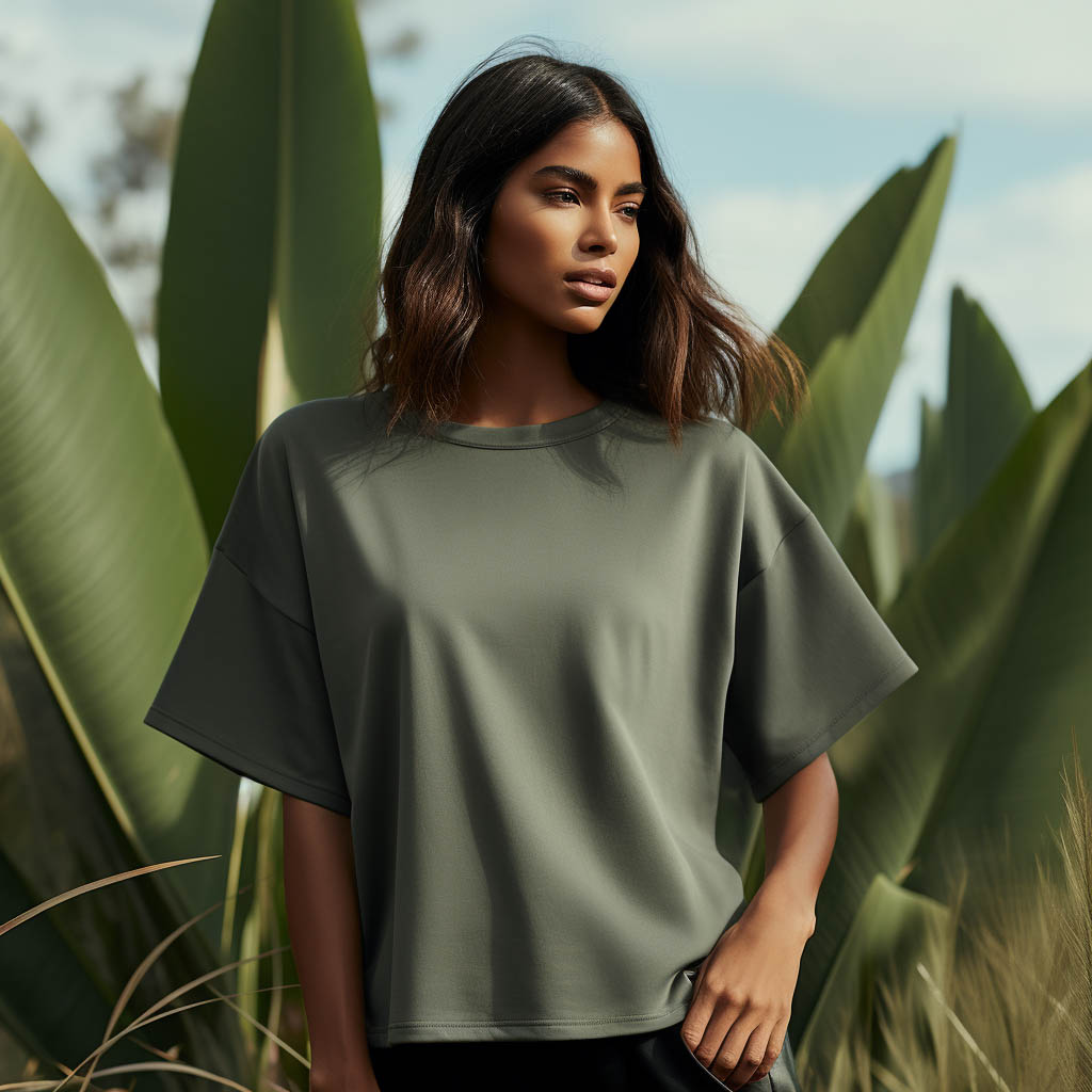 A woman wears an oversized T-shirt made from Performance Blends fabric fabric