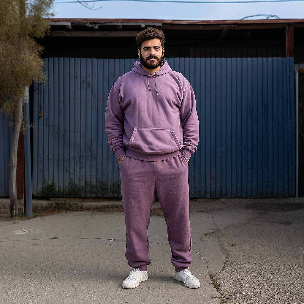 A man wearing a sweatsuit made of Cotton-Polyester Blend fabric.