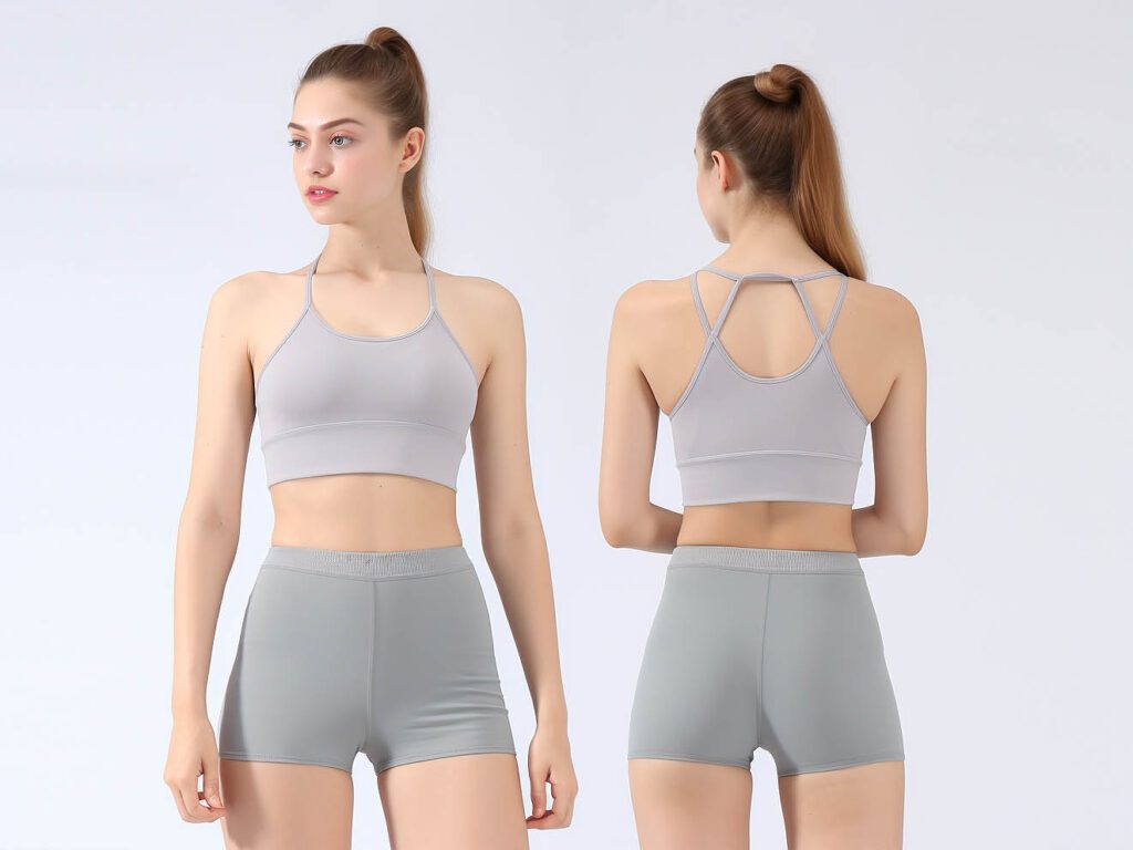 A woman wearing shorts and yoga bra set yoga clothes set solid color