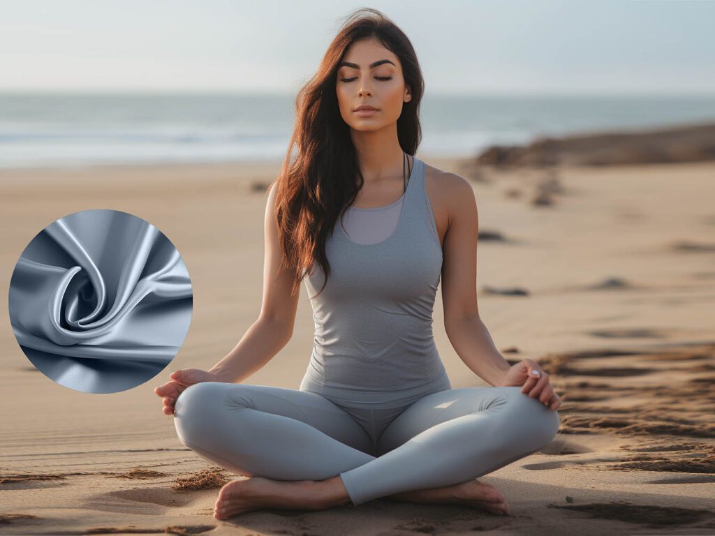 A woman wears yoga activewear made of Eco polyester fabric solid color