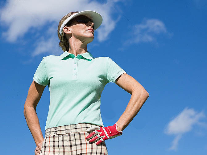woman standing on golf course