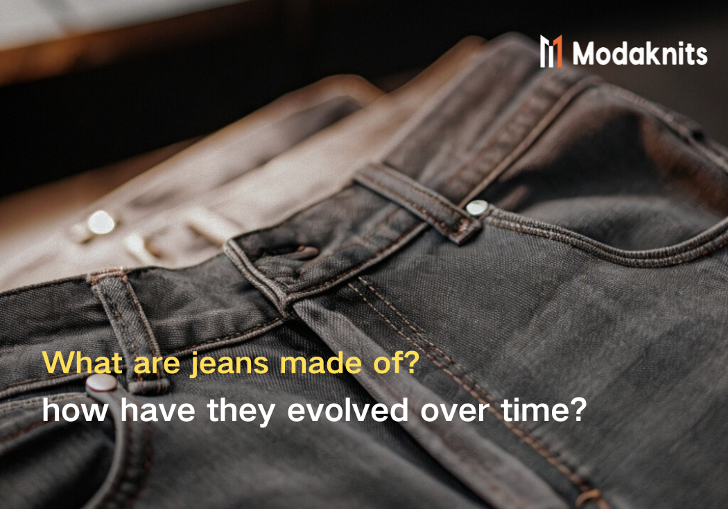 Close-up of black denim jeans highlighting the stitching and fabric texture under natural light.