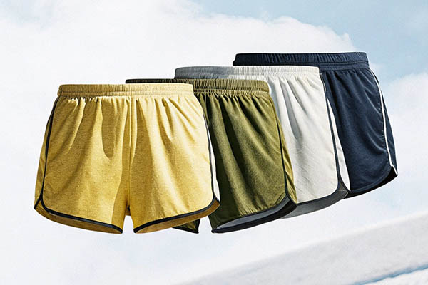 Lightweight running shorts in yellow, green, white, and navy colors.