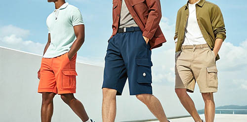 Men wearing colorful cargo shorts with casual shirts outdoors.