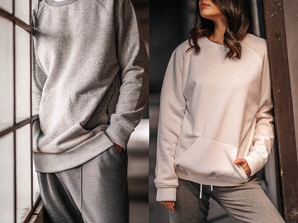 Two models wearing cozy sweatshirts in gray and beige, styled with matching joggers.