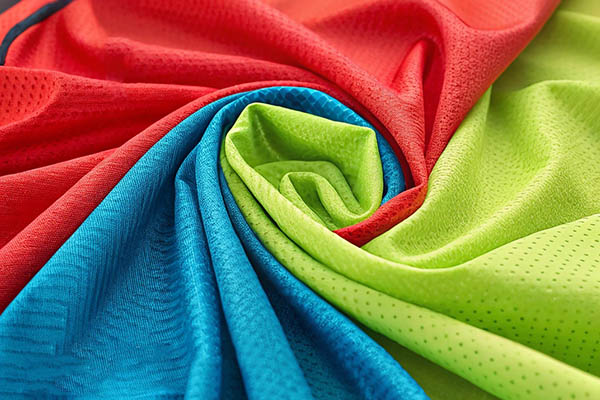 Red, blue, and green mesh fabrics swirled together.