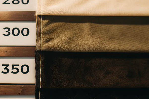 Fabric samples in various shades with weight measurements labeled 280, 300, and 350.