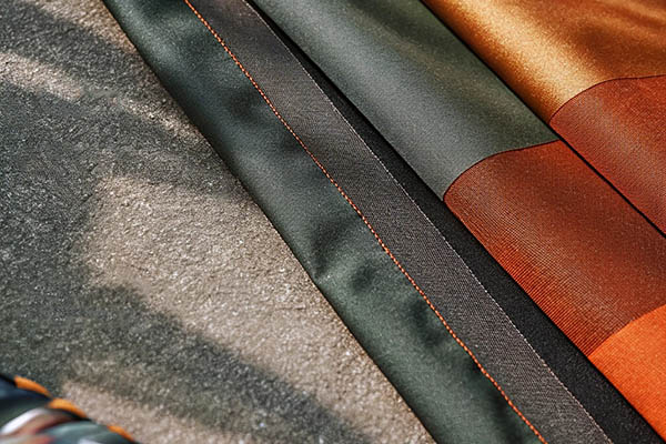 Durable fabric swatches with reinforced stitching in earthy tones.