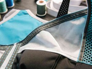 Close-up of blue and black sports bra with mesh panels