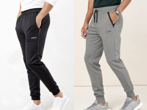 Two men wearing athletic jogger pants, one in black and one in gray, paired with sneakers and casual tops.