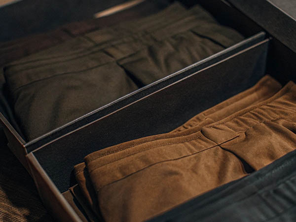 Dark green and brown boxer shorts neatly packed in a gift box.