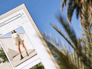 Online shopping screen showing woman in beige shorts and boots