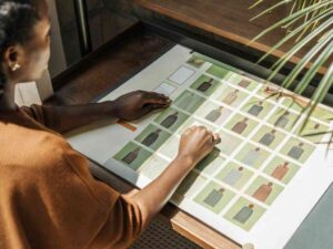 Woman reviewing fashion collection layout