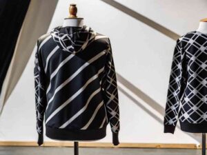 Black and white geometric hoodies on mannequins