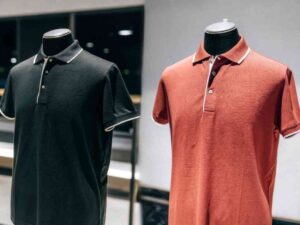 Side-by-side black and red polo shirts on mannequins