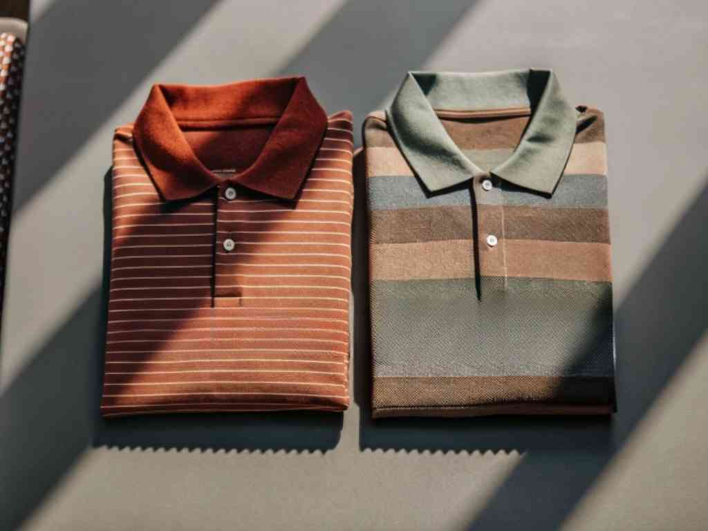 Folded striped polo shirts in rust and earth tones side by side