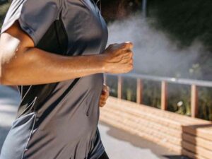Close-up of person running through mist outdoors