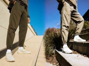 A split image showing two men in olive and tan jogger pants with elastic cuffs, standing outdoors on urban stairs.