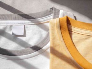 Close-up of white and yellow t-shirt collars with soft fabric texture