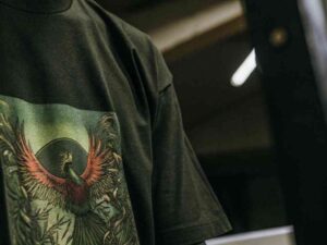 Black t-shirt with red and green phoenix illustration