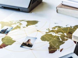 World map with photos and yellow lines connecting global network points.