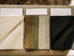Three neatly arranged fabric swatches showcasing textures and colors.