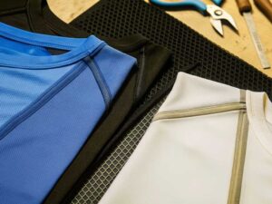 Flat lay of blue black and white athletic tees