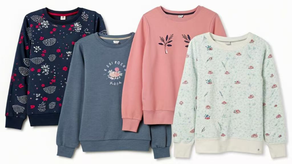 Four stylish sweatshirts with floral and graphic prints in different colors.