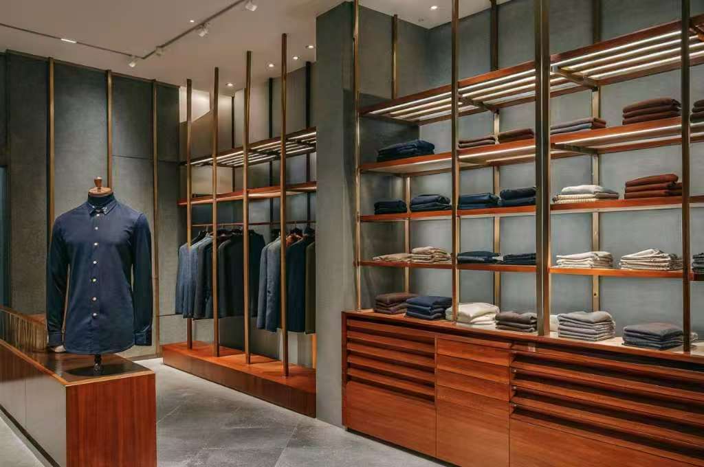 Luxury menswear boutique with neatly arranged shirts and jackets.