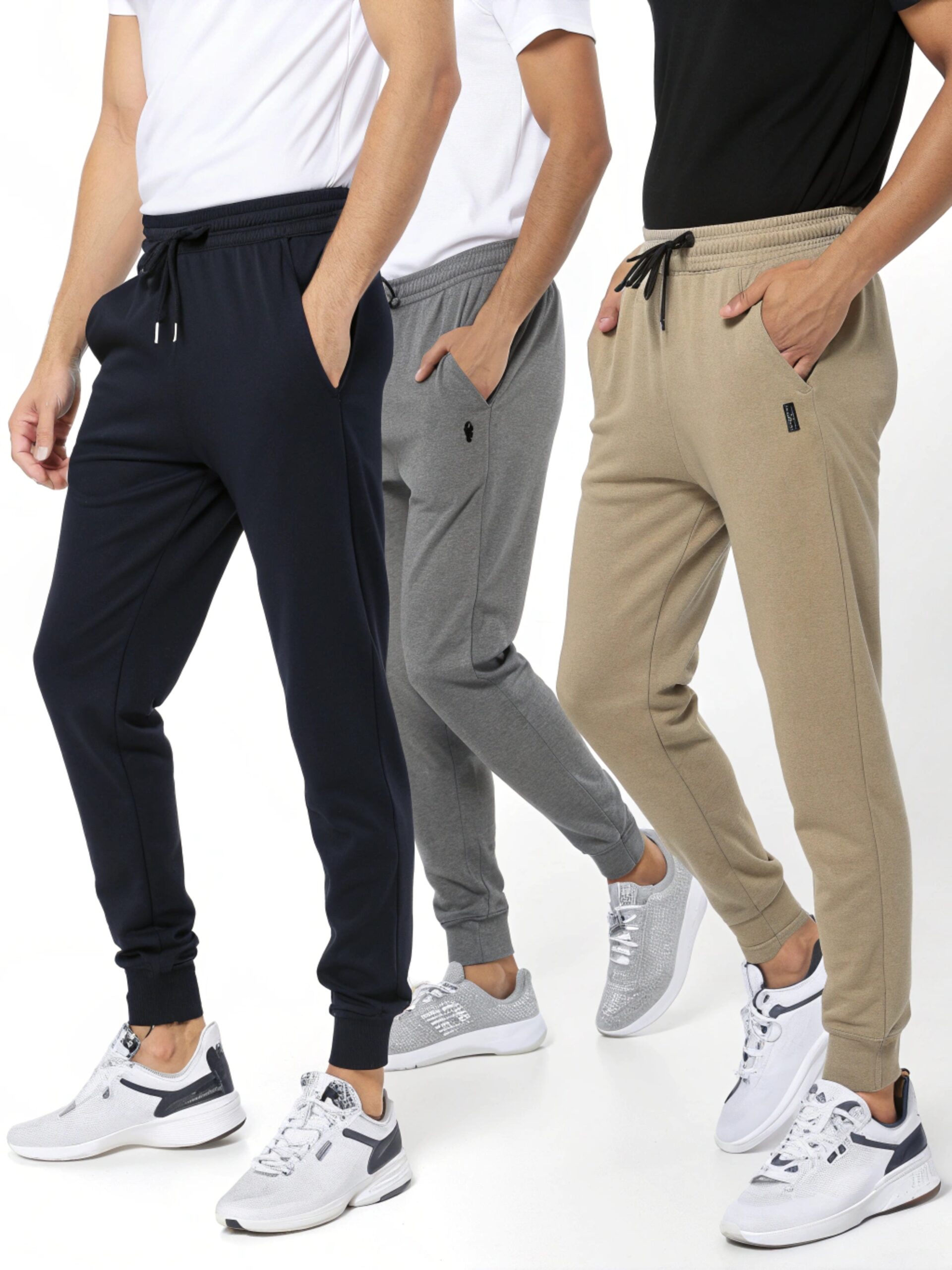 men wearing joggers in navy grey and beige with sneakers